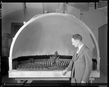 Ernest Deike, Planetarium Technician with his miniature Projection Planetarium, 1939.