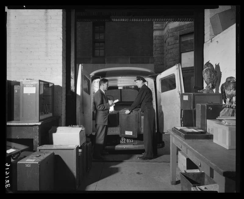 Museum Educator Carlton Beil inspecting loading of school service truck