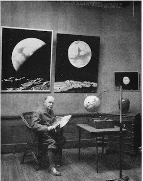 Butler pictured in his studio, a model of the Martian system visible on his desk.